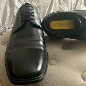 Black Kenneth Cole man’s shoes.